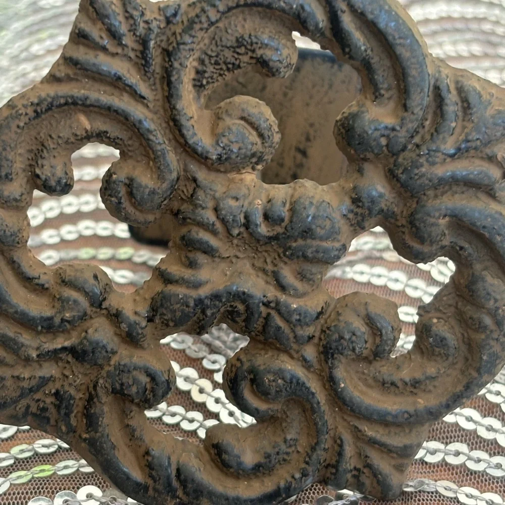 Antique cast iron curtain accents